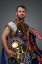 Antique greek commander with bronze armor and plumed helmet