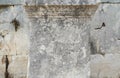 Antique greek inscriptions carved on the stone of the old ruins of an antique greek city