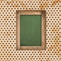 Antique green chalkboard over vintage polka dot background