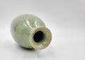 Antique green pottery Sake Bottle in white background for decoration and collectible