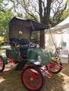 Antique green 1902 Rambler Model D Runabout roadster in a park. Autoclasica 2022 classic car show