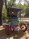 Antique green 1902 Rambler Model D Runabout roadster in a park. Autoclasica 2022 classic car show