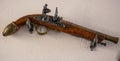 Antique gun on the wall Royalty Free Stock Photo