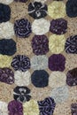 Antique handmade quilt table covering of patterned fabric circles.