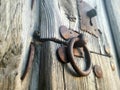 Antique hardware of the central part of an old wooden door.