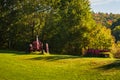 Antique historic red tractor left in a field