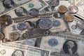 Antique, historic US Dollar banknotes next to new Dollar bills