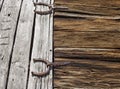 Antique horseshoes as barn door hinges Royalty Free Stock Photo