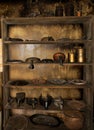 Antique Indian kitchenware arranged on the shelf.