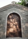 Antique iron arched door on brick stone wall in a historic brick building Royalty Free Stock Photo