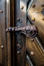 Antique iron forged door handle from the front door Royalty Free Stock Photo