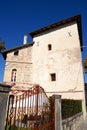 Antique iron gate, next to a building of the castle of Strassoldo Friuli (Italy) and intense blue sky