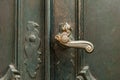 antique iron handle on the background of wooden door Royalty Free Stock Photo