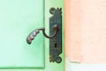 antique iron handle on the background of wooden door Royalty Free Stock Photo