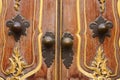 antique iron handle on the background of wooden door Royalty Free Stock Photo