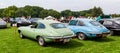 Antique Jaguars of different colors lined up