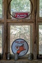 Antique Kayo and Texaco Gasoline signs in a window in Nevada, USA - November 4, 2022