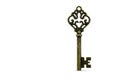 Antique key on a white background. Space for text. Royalty Free Stock Photo