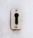 Antique keyhole on wooden door Royalty Free Stock Photo