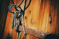 Antique keys against old wooden wall Royalty Free Stock Photo