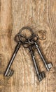 Antique keys over dirty wooden background Royalty Free Stock Photo