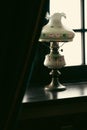 antique lamp behind a curtain