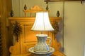 Antique lamp on dresser Royalty Free Stock Photo