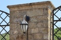 Antique lantern on a cracked brick wall