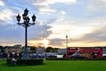 Antique lantern and a tourist bus at sunset in Saint-Petersburg