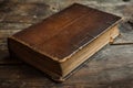 Antique leather-bound book on a wooden table