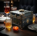 Antique leather and bronze box next to a glass of liquor