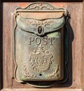 Antique letter box at a wooden door