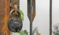 An antique lock on a rusted handle