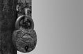 An antique lock on a rusted handle in black and white Royalty Free Stock Photo