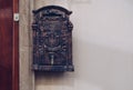 Antique looking mail box near door
