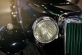 Antique luxury car front headlight. Royalty Free Stock Photo