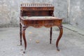 Antique mahogany writing desk with ornate carving