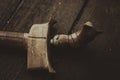 Antique malay dagger or Keris on wooden floor.low light shot, image may contain grain Royalty Free Stock Photo