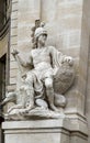 An antique male statue at the entrance to the Army Museum at Les Invalides complex, Paris Royalty Free Stock Photo