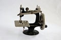 Antique manual hand crank sewing machine. Royalty Free Stock Photo