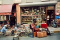 Antique market and people drinking tea near vintage furniture store