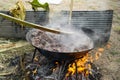 Antique meat casserole boiling with firewood and natural equipment