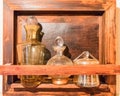 Antique medicinal glass bottles in antique cabinet