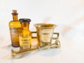 Antique Medicine Bottles and Mortar: Lapisvand and Glandula Lupuli on White Background