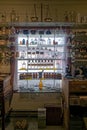 Antique medicine bottles on a shelf in the window in California, USA - November 6, 2022 Royalty Free Stock Photo