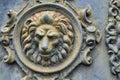 Antique metal bas-relief decoration, head of a lion