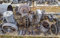 Antique metal engine parts on a pallet outside Royalty Free Stock Photo