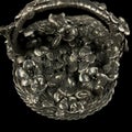 Antique metal figurine in the form of a basket with flowers