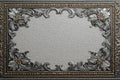 Antique metal frame featuring silver floral and rococo embossing with a textured background Royalty Free Stock Photo