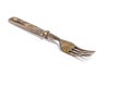 Antique metal rusty fork on a white background Royalty Free Stock Photo